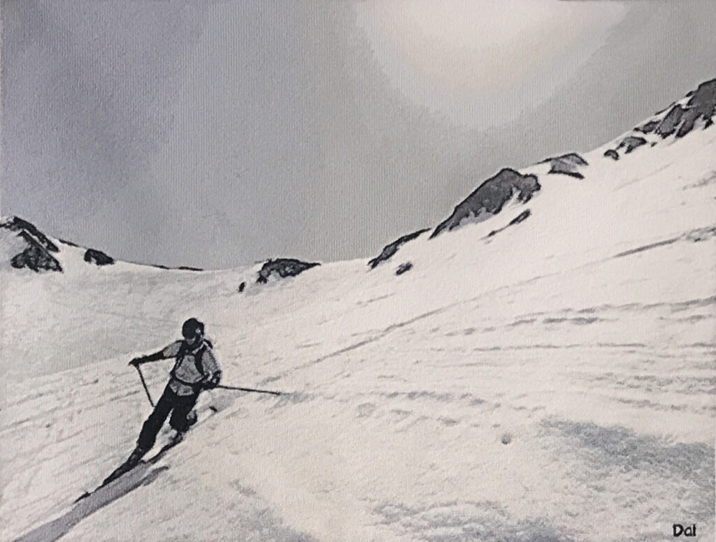 Photo embroidery artwork of a skier descending a snowy mountain. Serene winter landscape with the Tateyama mountain range and soft sunlight above.